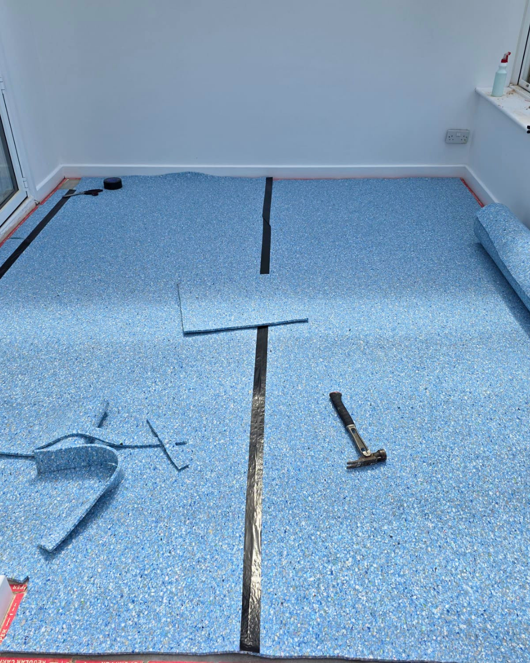 New blue underlay and gripper rods laid before carpet refit