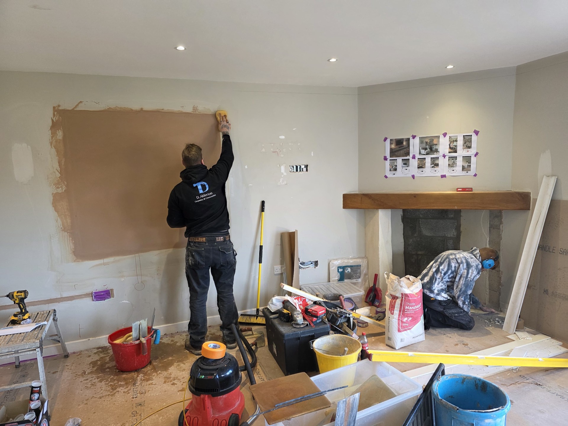 Dan preparing the wall with fresh plaster ready for panelling