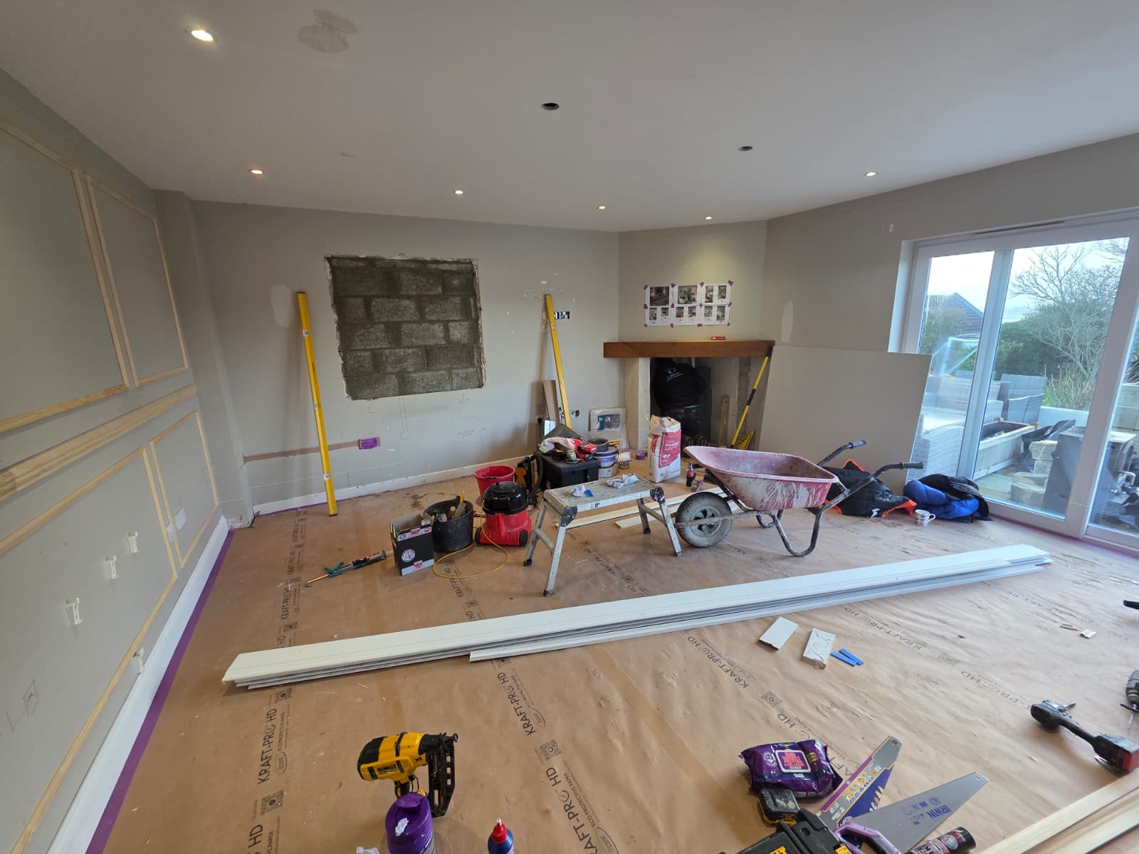 Timber framing being set out on the wall for bespoke panelling