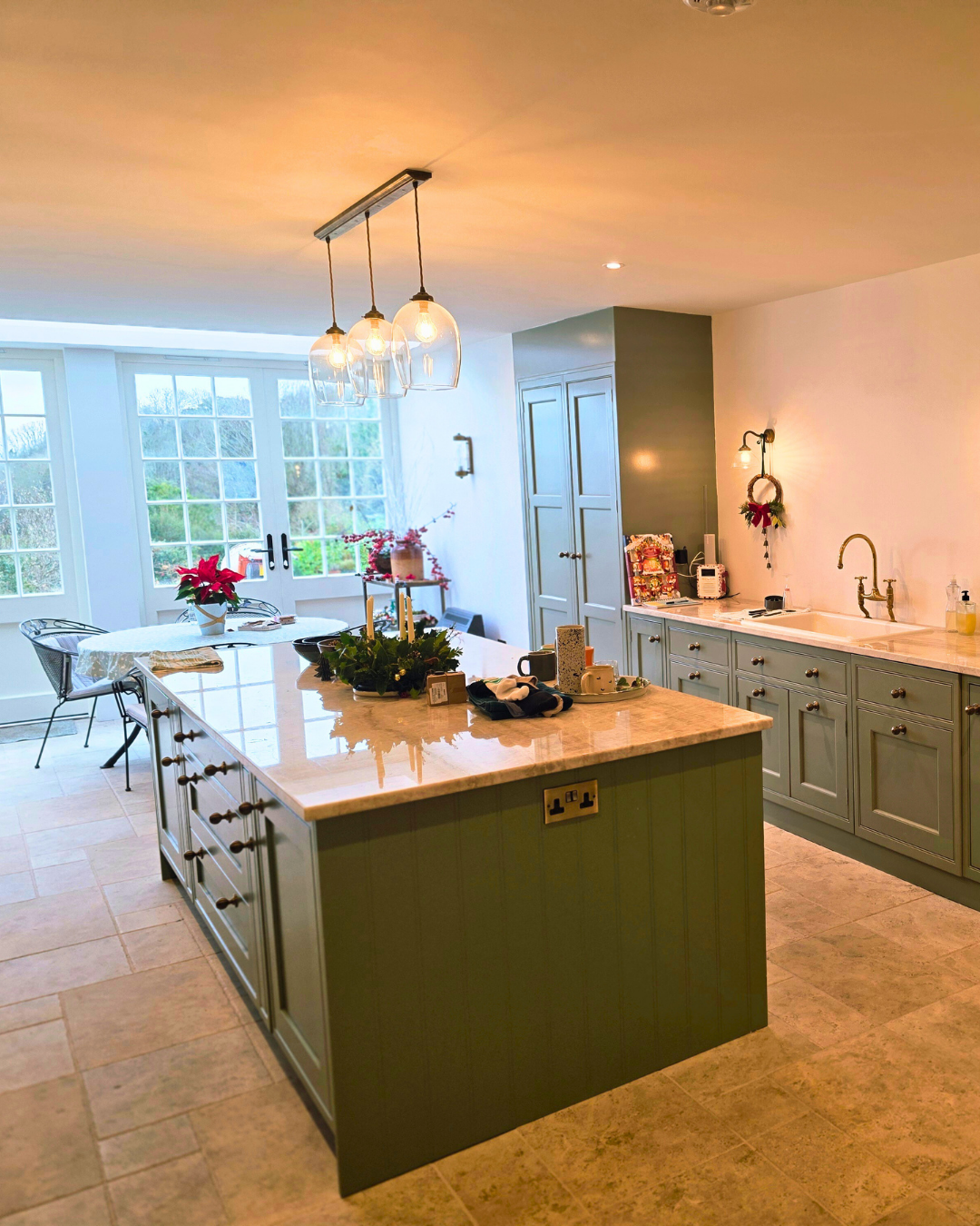Kitchen sink run with brass tap and stone worktop