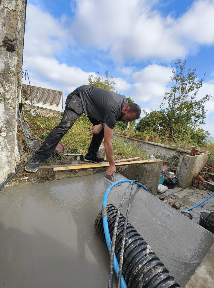 Dan finishing a fresh concrete pour